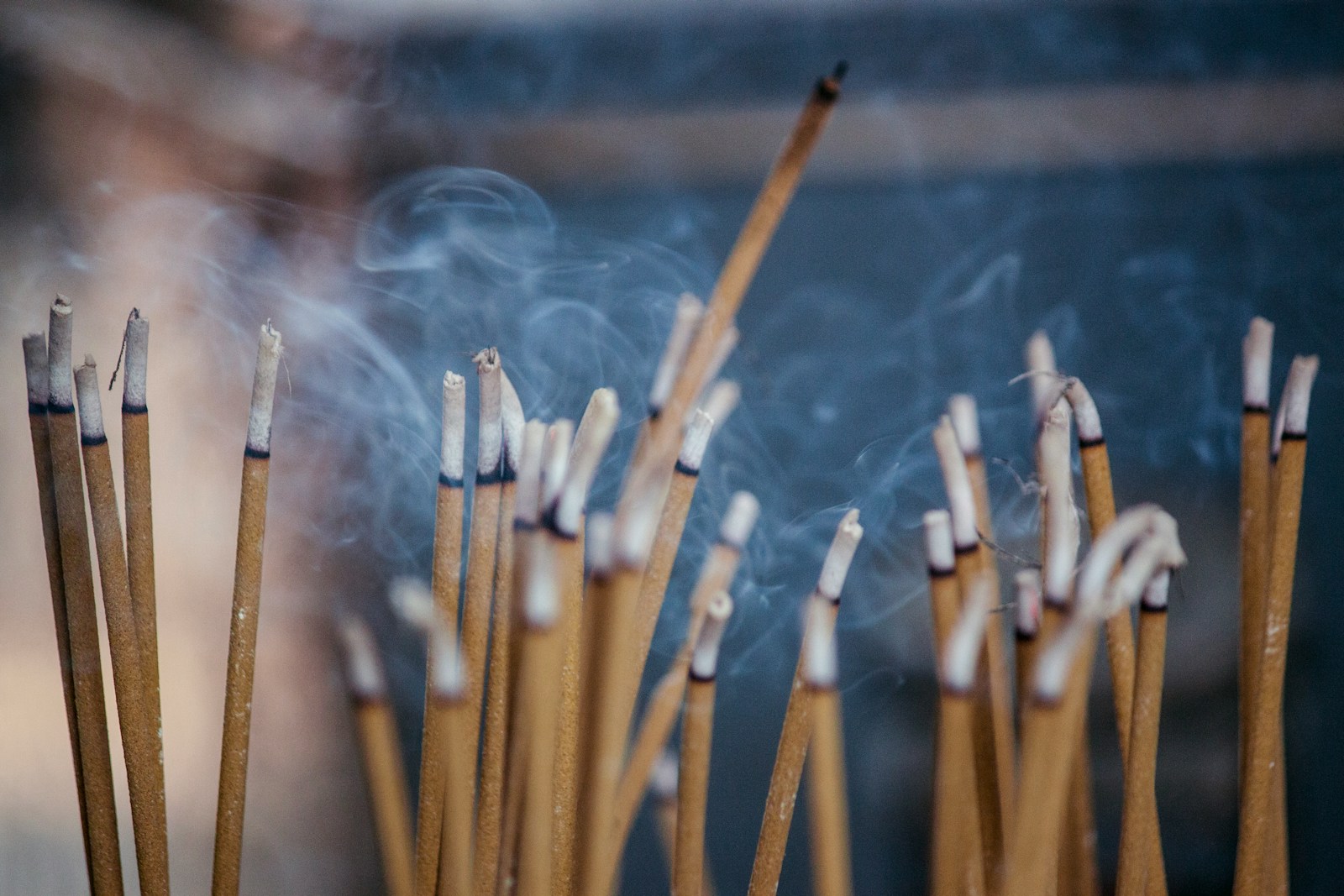 brown wooden sticks with white smoke